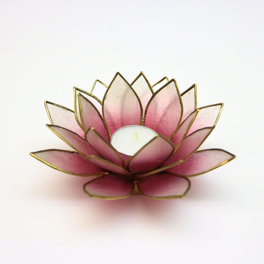 Handcrafted lotus-shaped capiz shell tealight holder in pink and natural white with gold trim, showcasing delicate petals and a central space for a candle