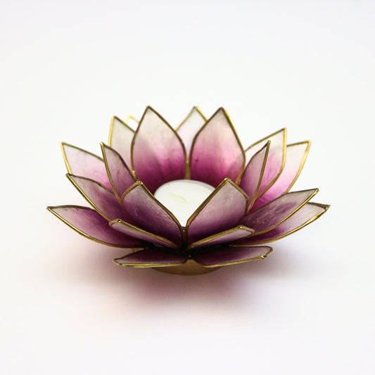 Handcrafted lotus-shaped capiz shell tealight holder in purple and natural tones with gold trim, showcasing translucent petals for elegant light diffusion and a serene ambiance