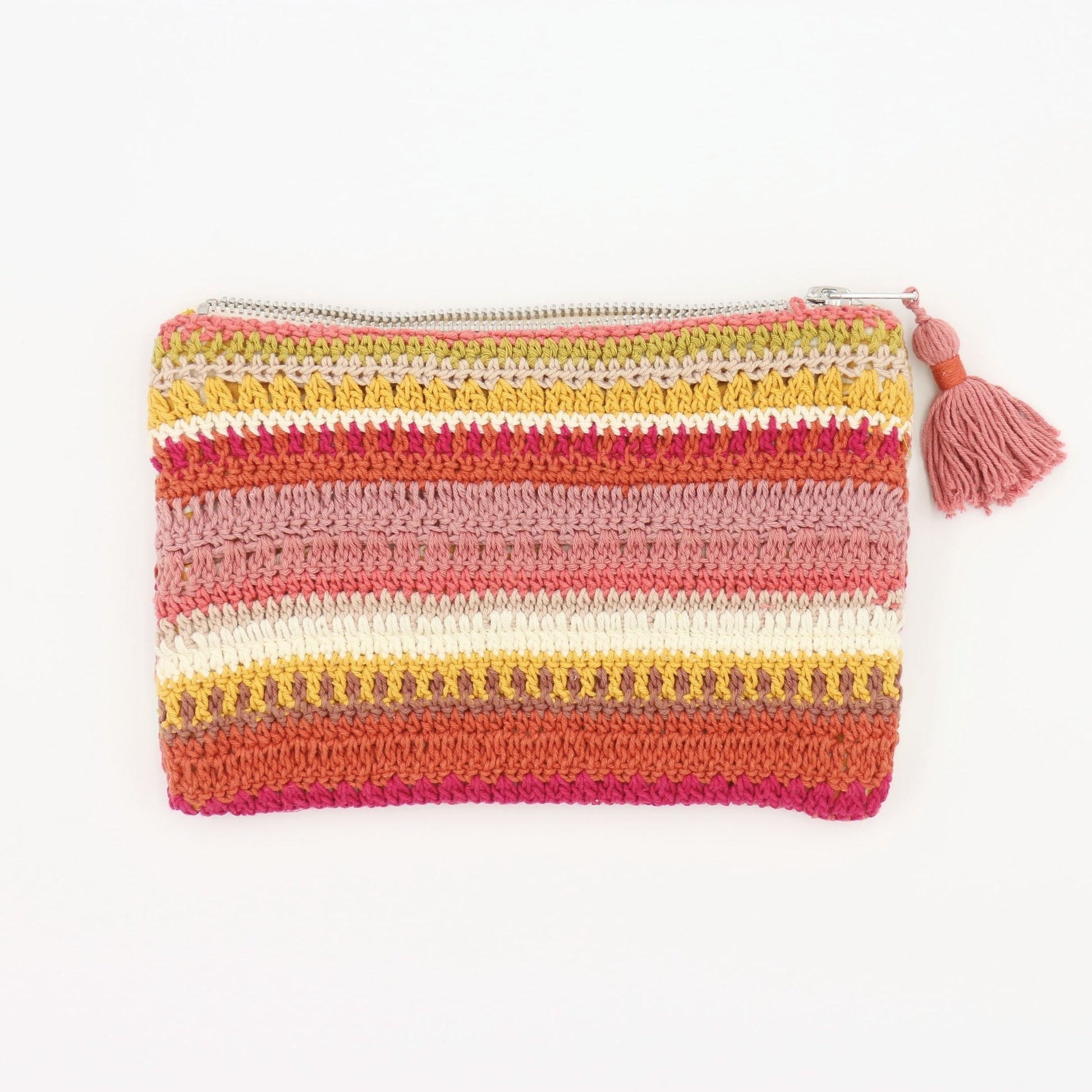 Handmade crochet clutch bag in warm striped colors with zipper closure and tassel, featuring various textured stitches in cotton yarn. Slim profile suitable for holding essentials or as an iPad mini sleeve.