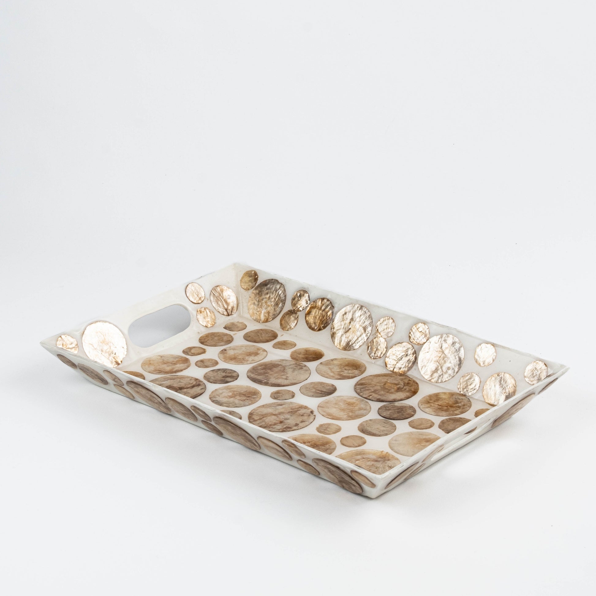 Decorative capiz shell tray with dotted pattern, handmade from upcycled seashells in cream white and golden brown, embedded in resin for durability and elegance. Ethically sourced and sustainably produced Indonesian artisan craft.