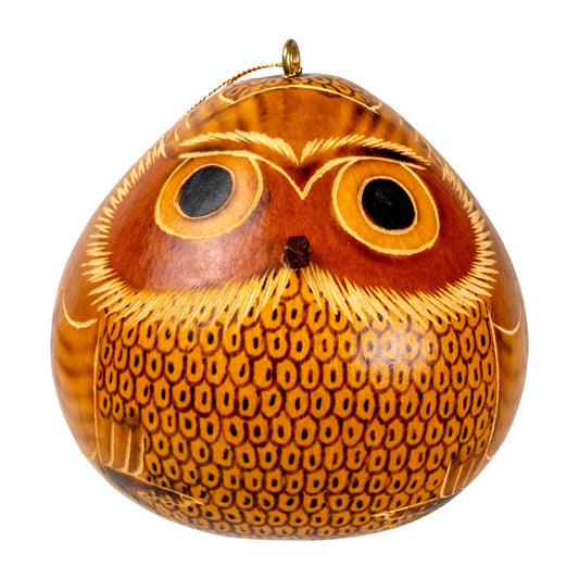 Handcrafted blond owl gourd ornament with intricate carved details, featuring large eyes and textured feathers. Peruvian artisan-made, eco-friendly home decor piece in warm golden-brown tones.