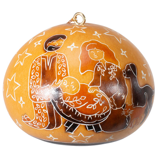 Hand-carved gourd ornament featuring a nativity scene with stylized figures, stars, and animals on an orange background, showcasing traditional Peruvian artistry and sustainable holiday decor