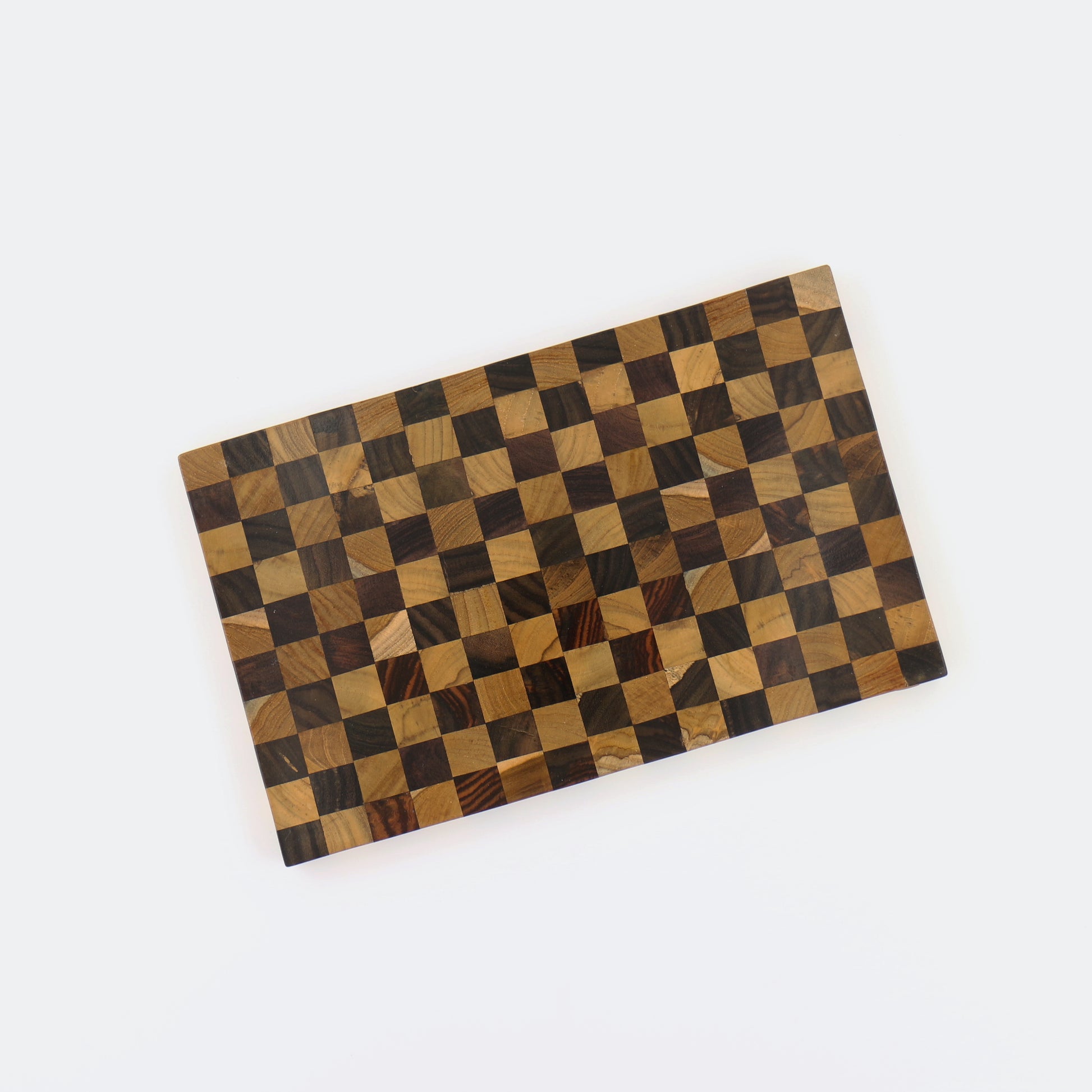 Eco-friendly checkered end grain cutting board made from mixed reclaimed wood, featuring alternating light and dark squares in a visually striking pattern, ideal for serving and food preparation