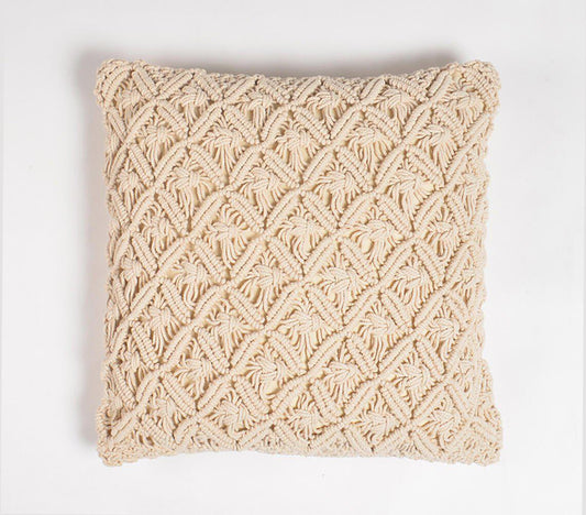 Handmade macrame square cushion cover in natural white cotton, featuring intricate diamond pattern weaving and knotwork, showcasing artisanal craftsmanship and modern bohemian style for home decor