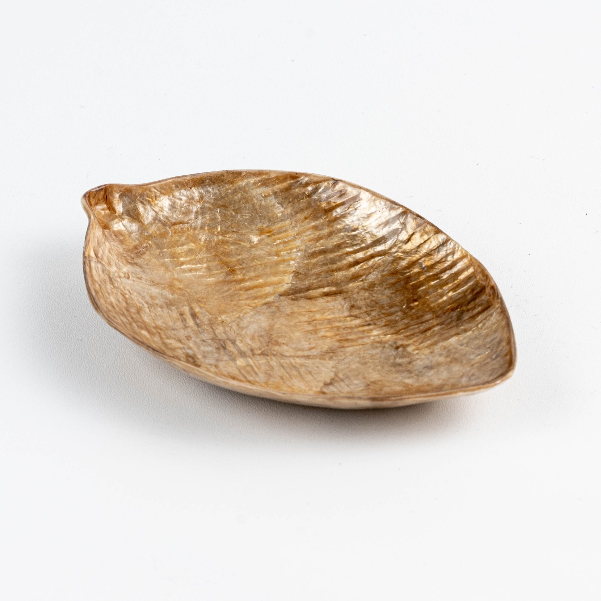 Golden leaf-shaped mini dish made from capiz shells and resin, featuring a textured surface with natural golden-brown color. Handcrafted, eco-friendly jewelry or snack plate with unique, luxurious appearance.