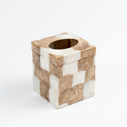 Square tissue box holder with white and gold patchwork pattern made from capiz shells and resin. Handcrafted luxury bathroom accessory with eco-friendly materials and ethical production.